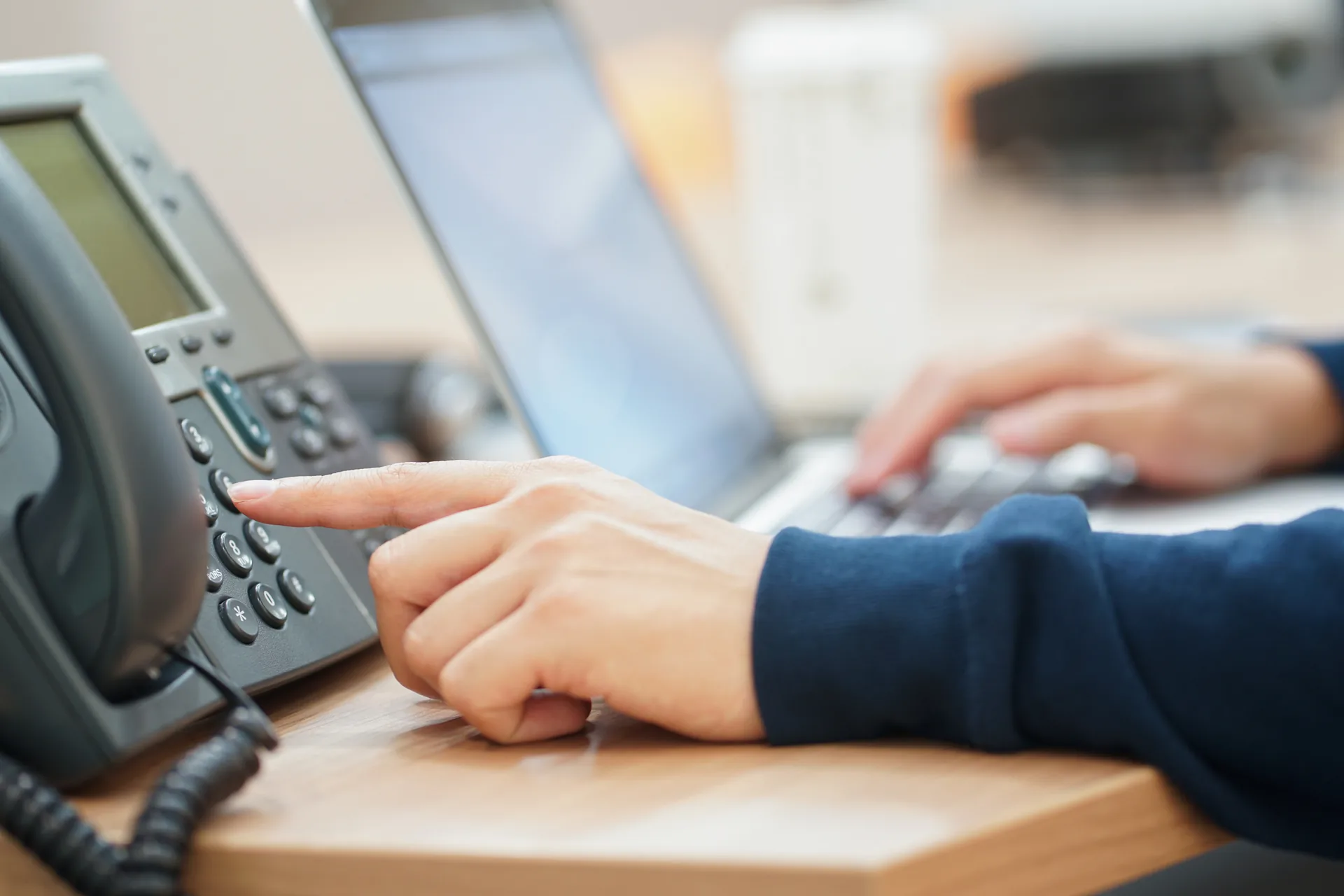 Business team using a cloud VoIP phone system